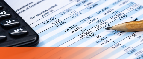 Close-up of financial statements with pencil and calculator, for Inside the Numbers in the Finance Certificate.