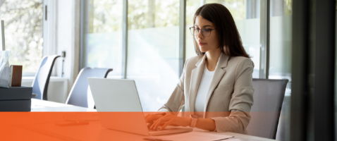 Professional working on laptop, representing Managing the Working Capital Cycle in the Finance Certificate.