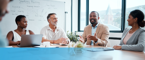 Diverse team in discussion, representing Leading Diverse and Inclusive Teams in the Management Certificate.