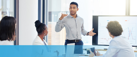 Professional presenting to colleagues, representing Leading Through Communication in the Management Certificate.